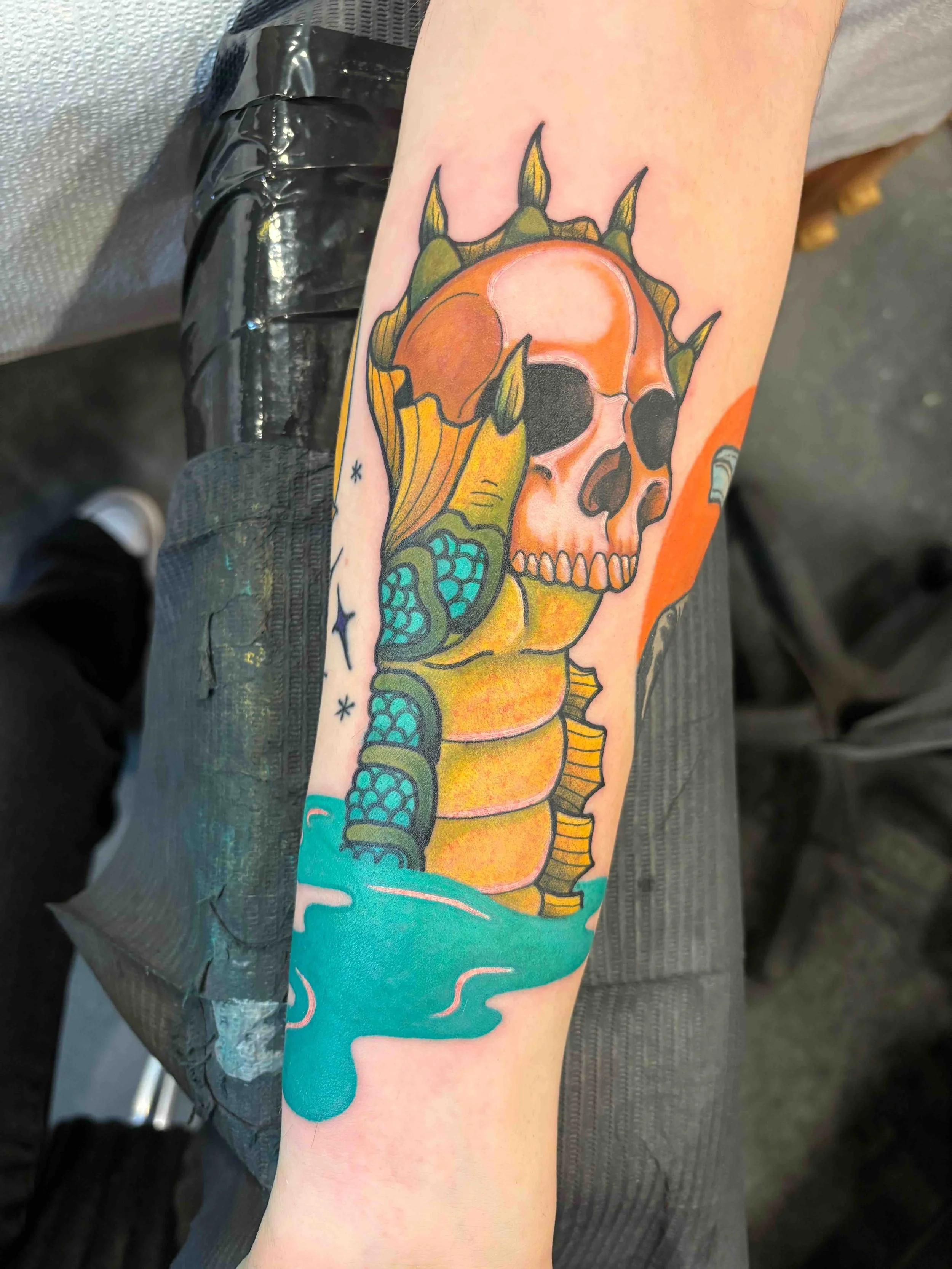 traditional style skull and dragon tattoo, portfolio work by Sam Sullivan at Sink or Swim Tattoo and Piercing in Niagara Falls, NY