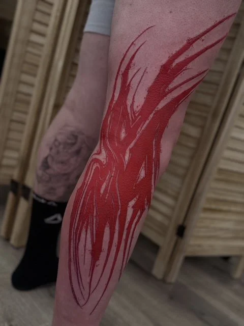 dark art ornamental red leg tattoo , portfolio work by Jordy Levea at sink or swim tattoo and piercing in Niagara Falls, ny