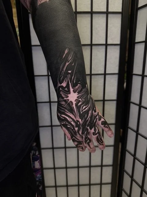 blackout and fluid black ornamental hand and finger tattoo , portfolio work by Jordy Levea at sink or swim tattoo and piercing in Niagara Falls, ny