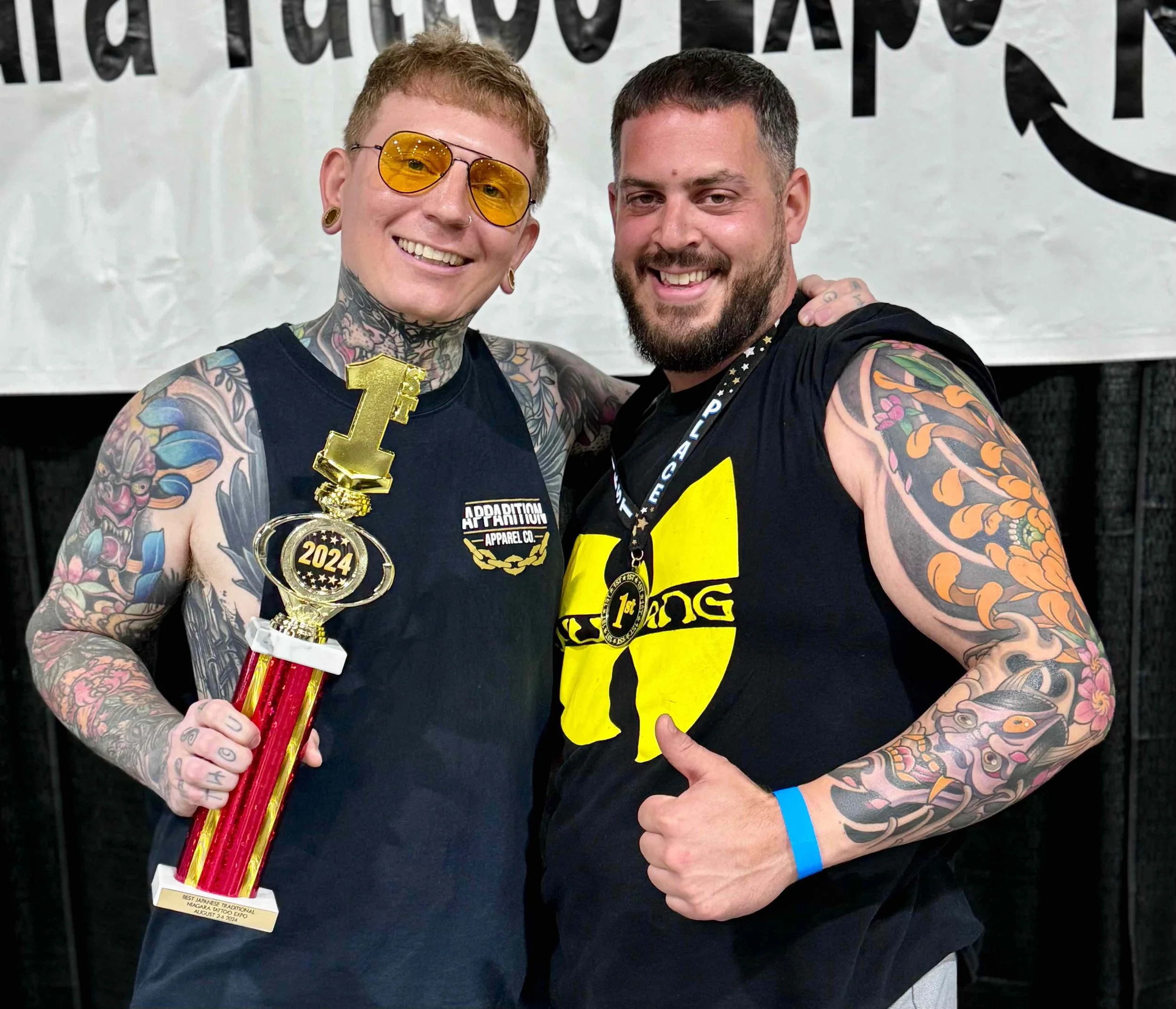 Keith holding a first place trophy from the Niagara Falls tattoo convention