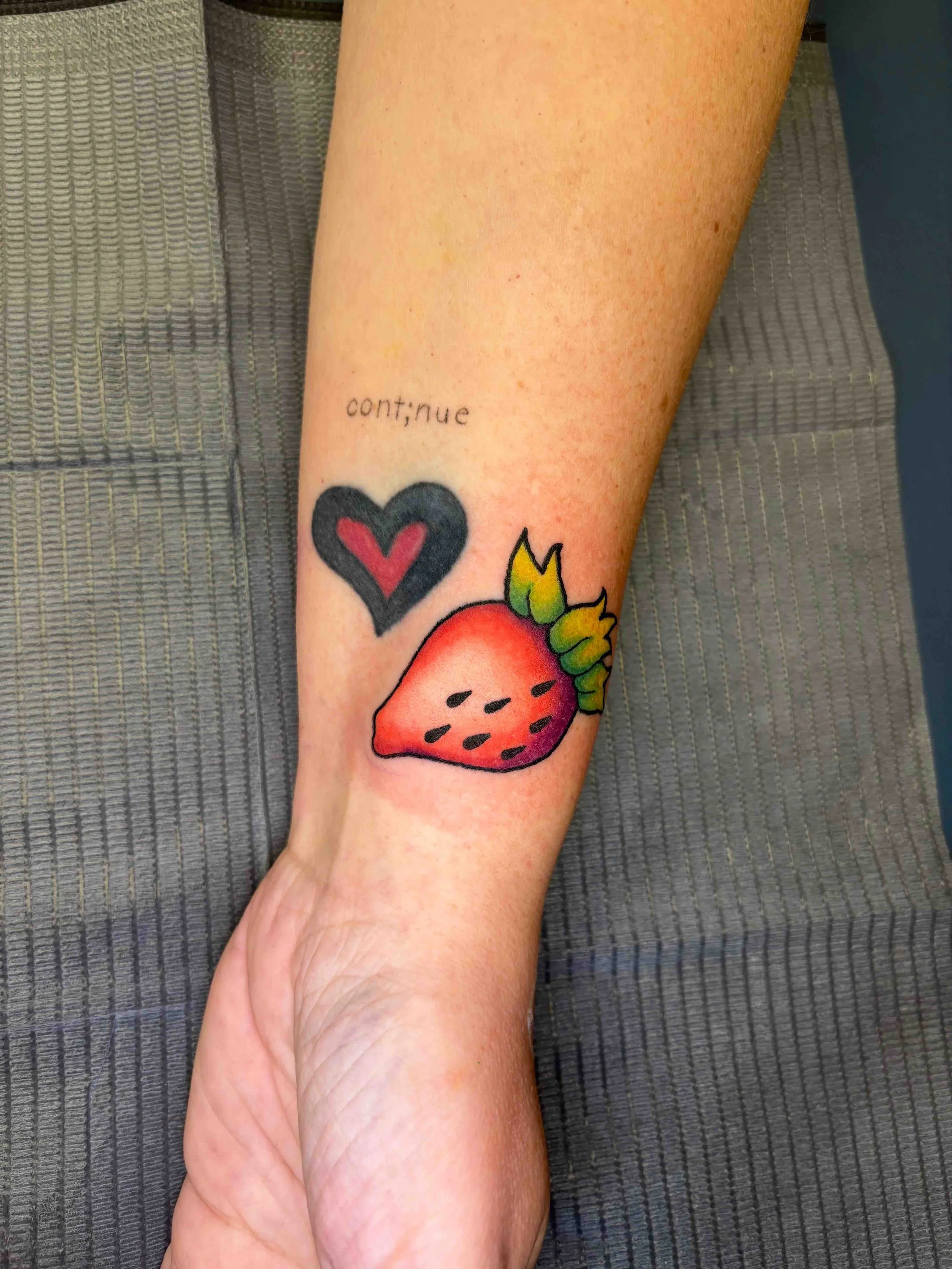 Neo traditional strawberry in color, portfolio work by AK Zaionz at Sink or Swim in Niagara Falls NY