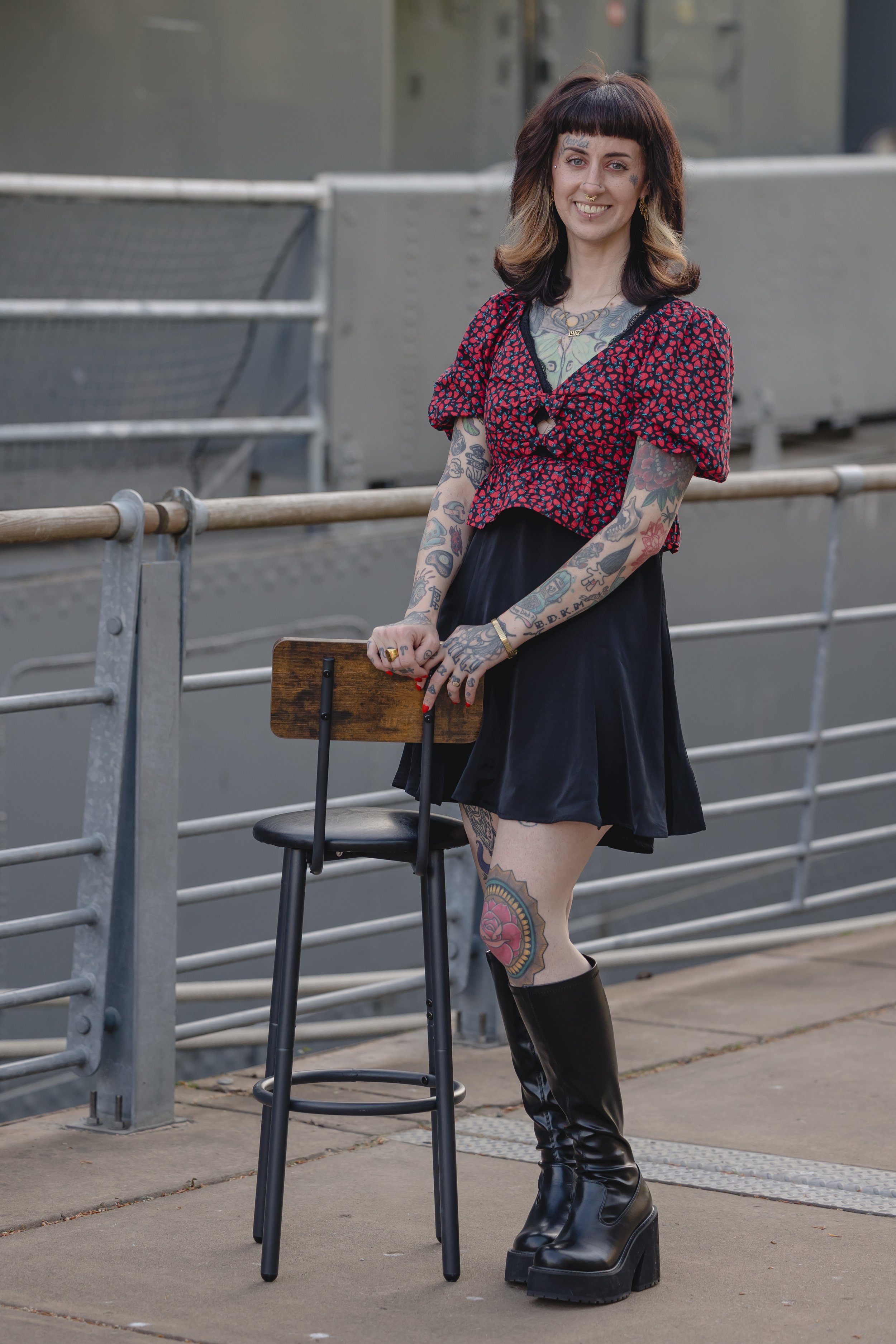 tattoo artist sam Sullivan from sink or swim tattoo and piercing standing outside for a lifestyle photograph
