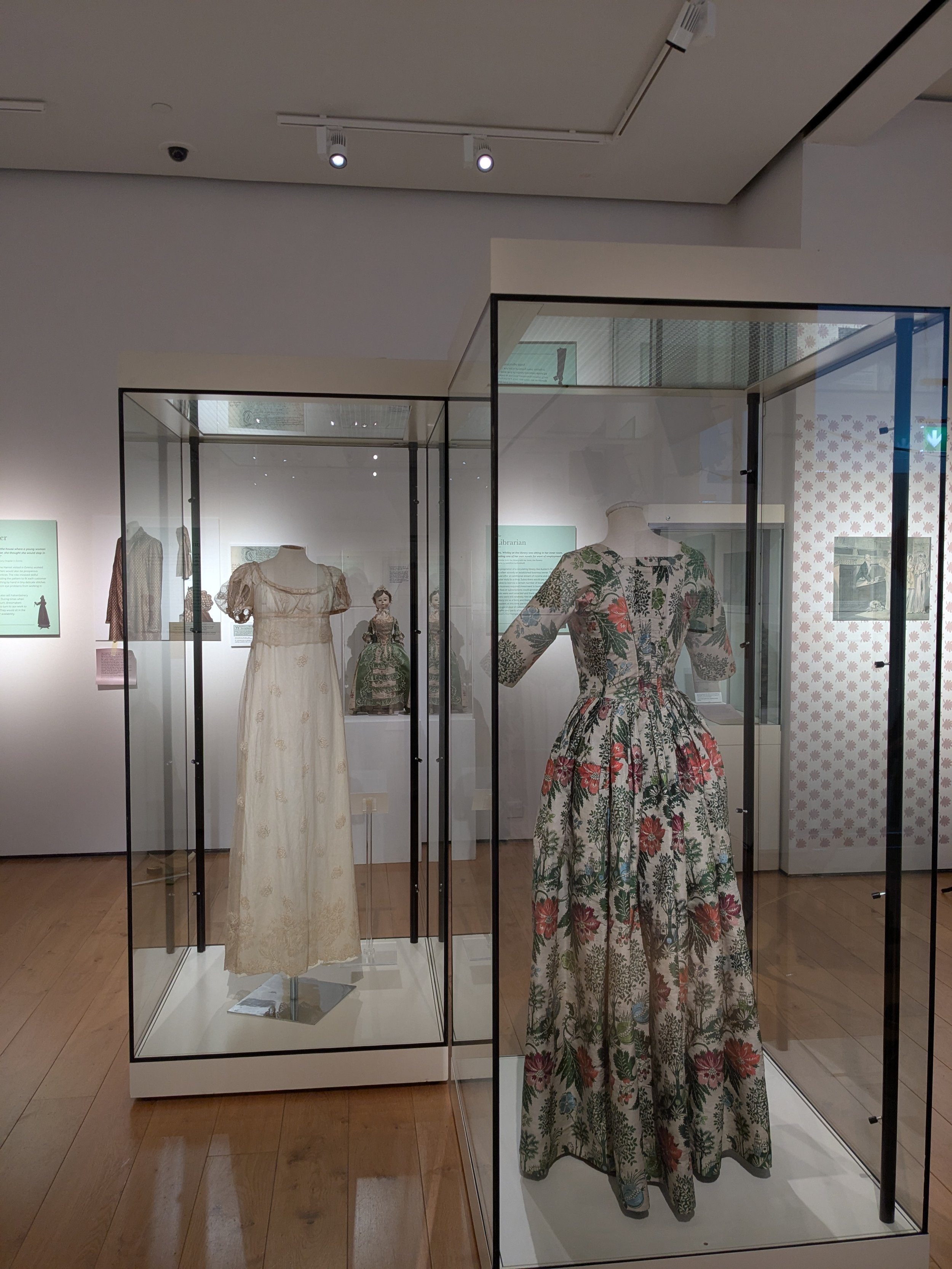 The Dressmaker - view of two historic dresses on display.