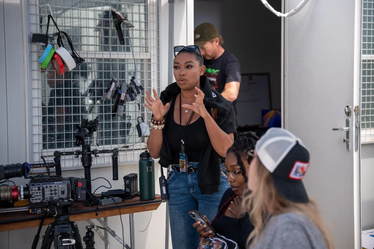 Producers Sharrika Evans and Kennedy Hall, cinematographer Matt Fremstad, and director Savannah Bearden in a crew meeting on-site at RiverBeat Music Fest 2026. Tom Lee Park, Memphis.