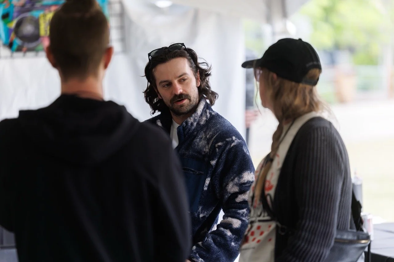 Director Savannah Bearden, B-roll DP David Roseberry, and video editor Tyler Woodward of agency. backstage at RiverBeat Music Fest 2026. Tom Lee Park, Memphis.