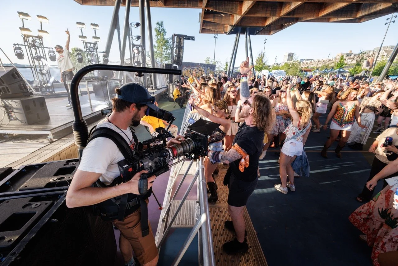 Peter Braswell films the audience at RiverBeat Music Fest 2026 for Agency. Tom Lee Park, Memphis.
