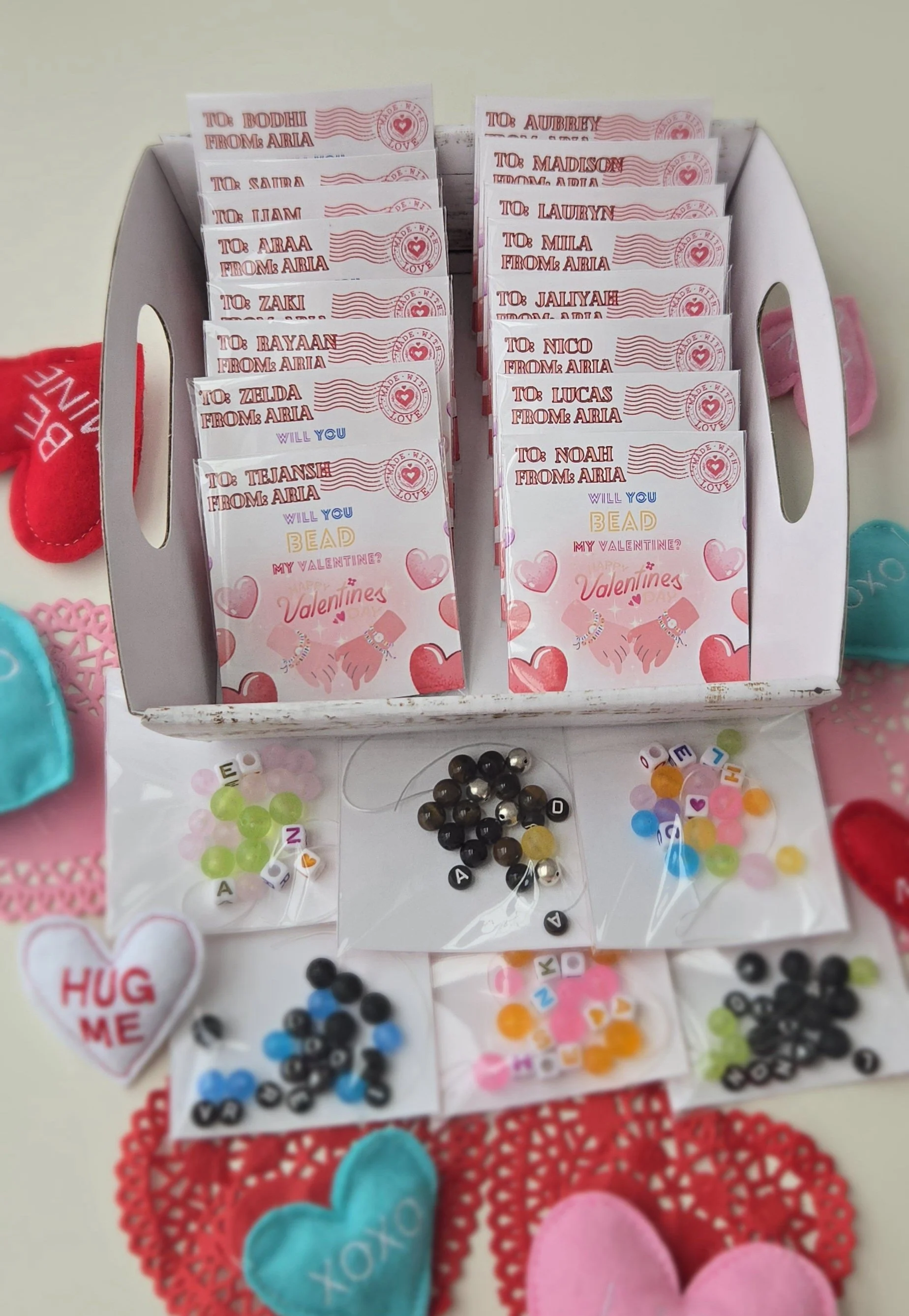 Classroom valentine cards addressed to each classmate, reading Will You Bead My Valentine, with small bags of beads