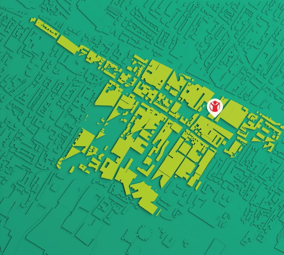 Mappa tridimensionale di una zona urbana con un'icona rossa e bianca di un'agenzia delle consegne un centro commerciale, evidenziata in bianco.