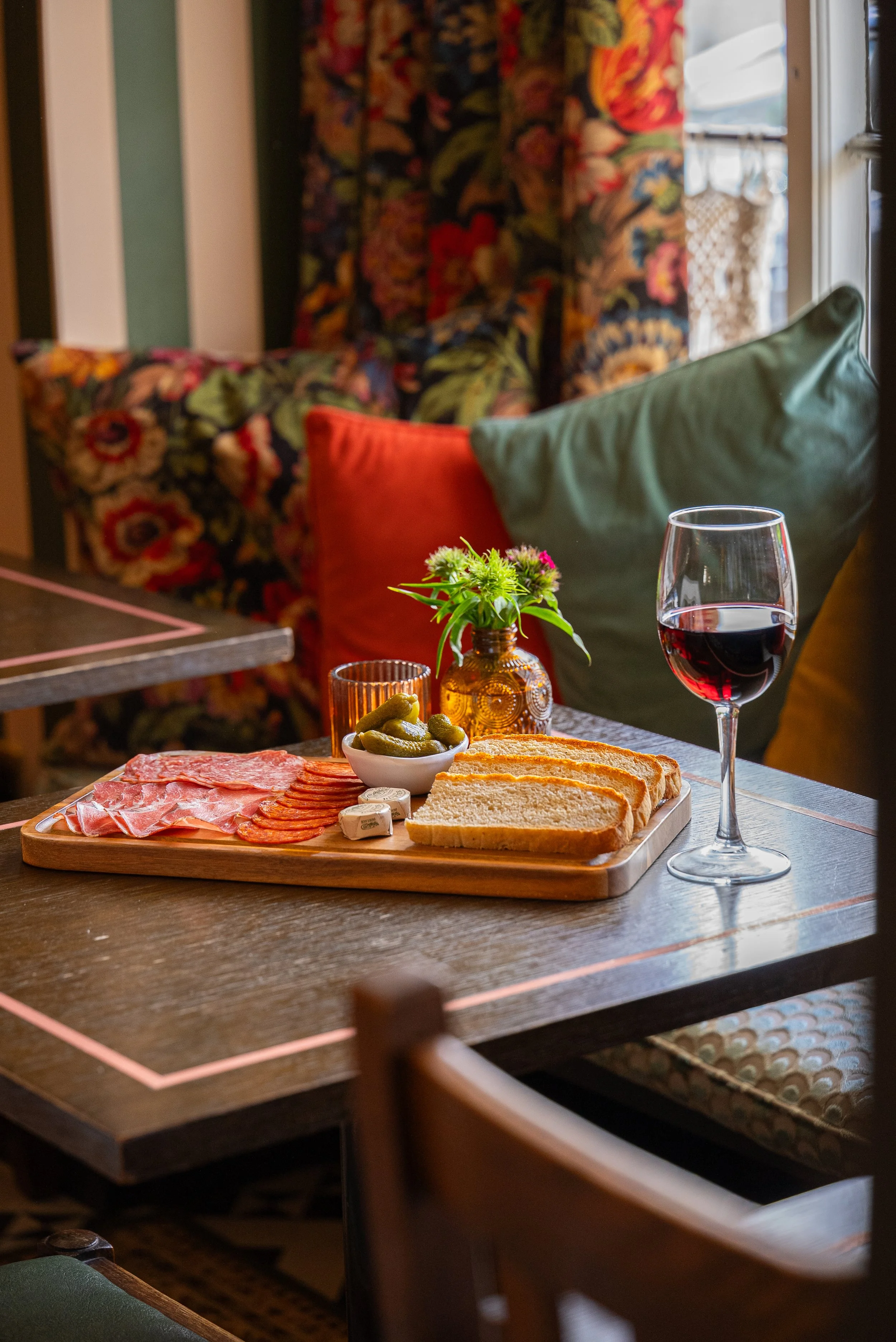 Window seat, wine, platter.jpg
