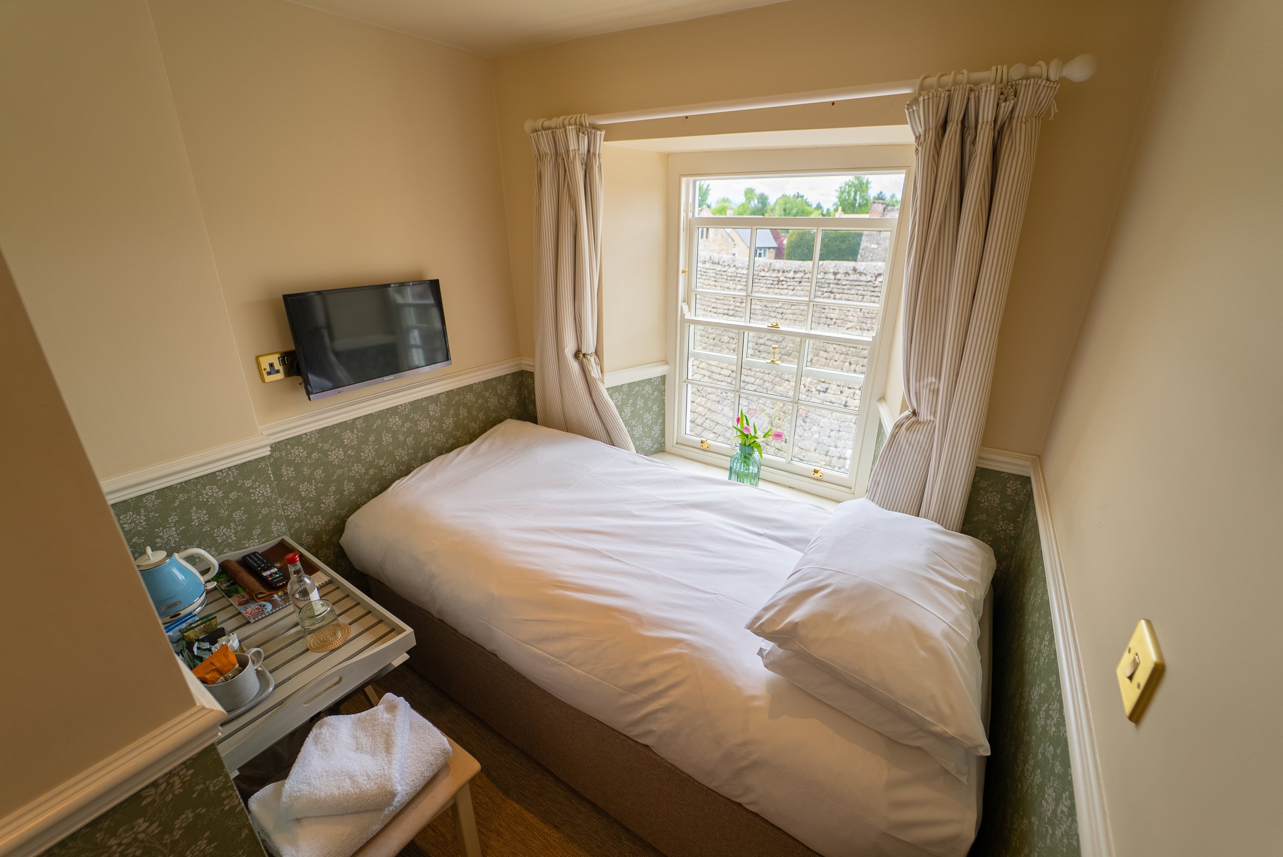 ROOM 9- DESCRIPTION: Room type= Very Small Single. Single bed. Second floor. Located at the side. Walk-in shower. This room is not much larger than the bed. Suitable for smaller adults.