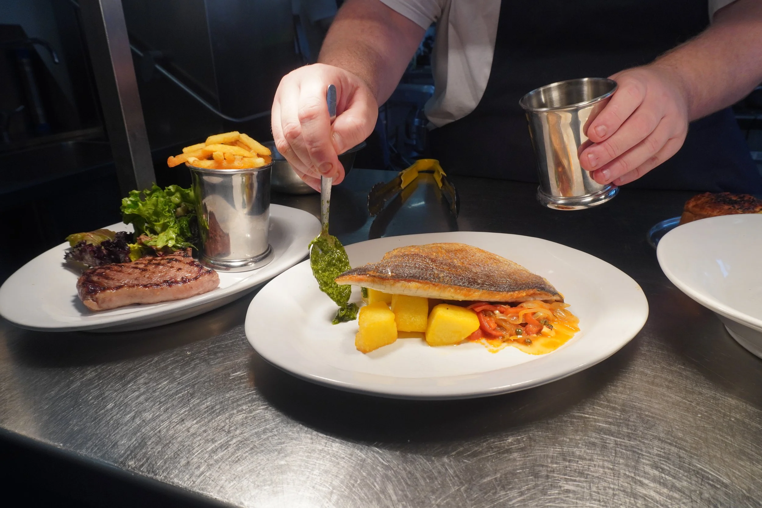 Kitchen chef dishes fish steak.JPG