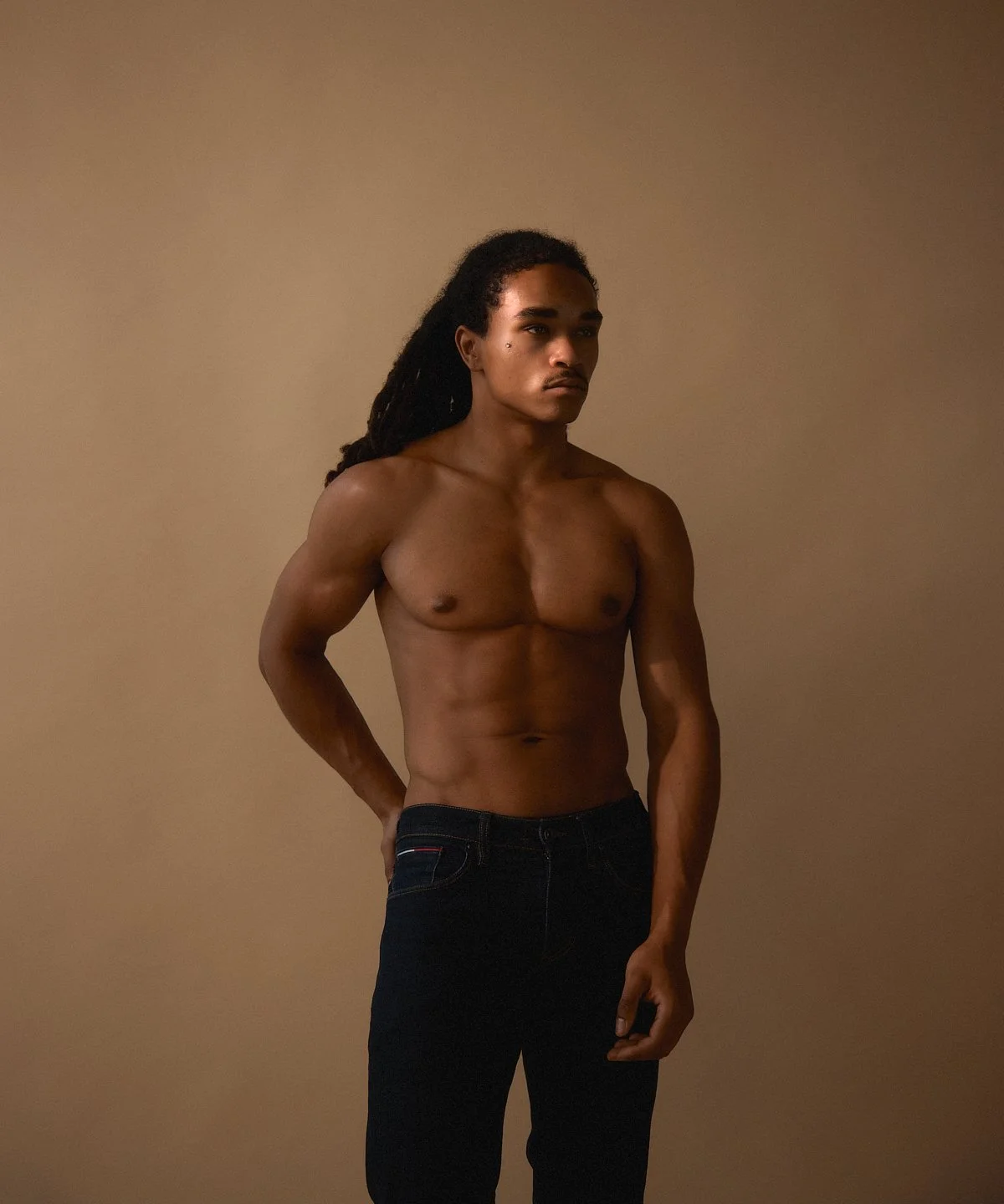 Daylight model test: full-length portrait against a plain backdrop