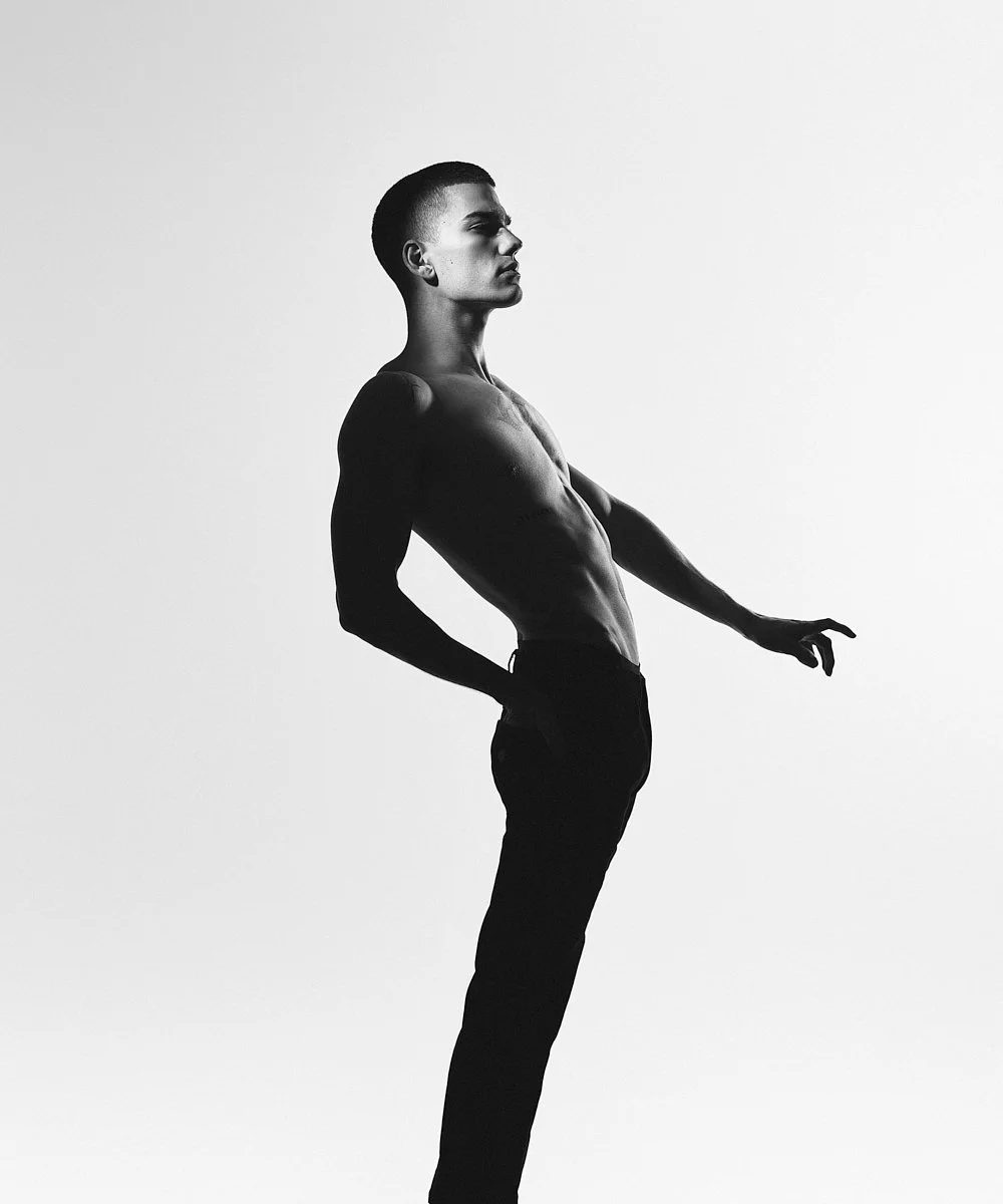 Model test in black and white: shirtless full-length portrait