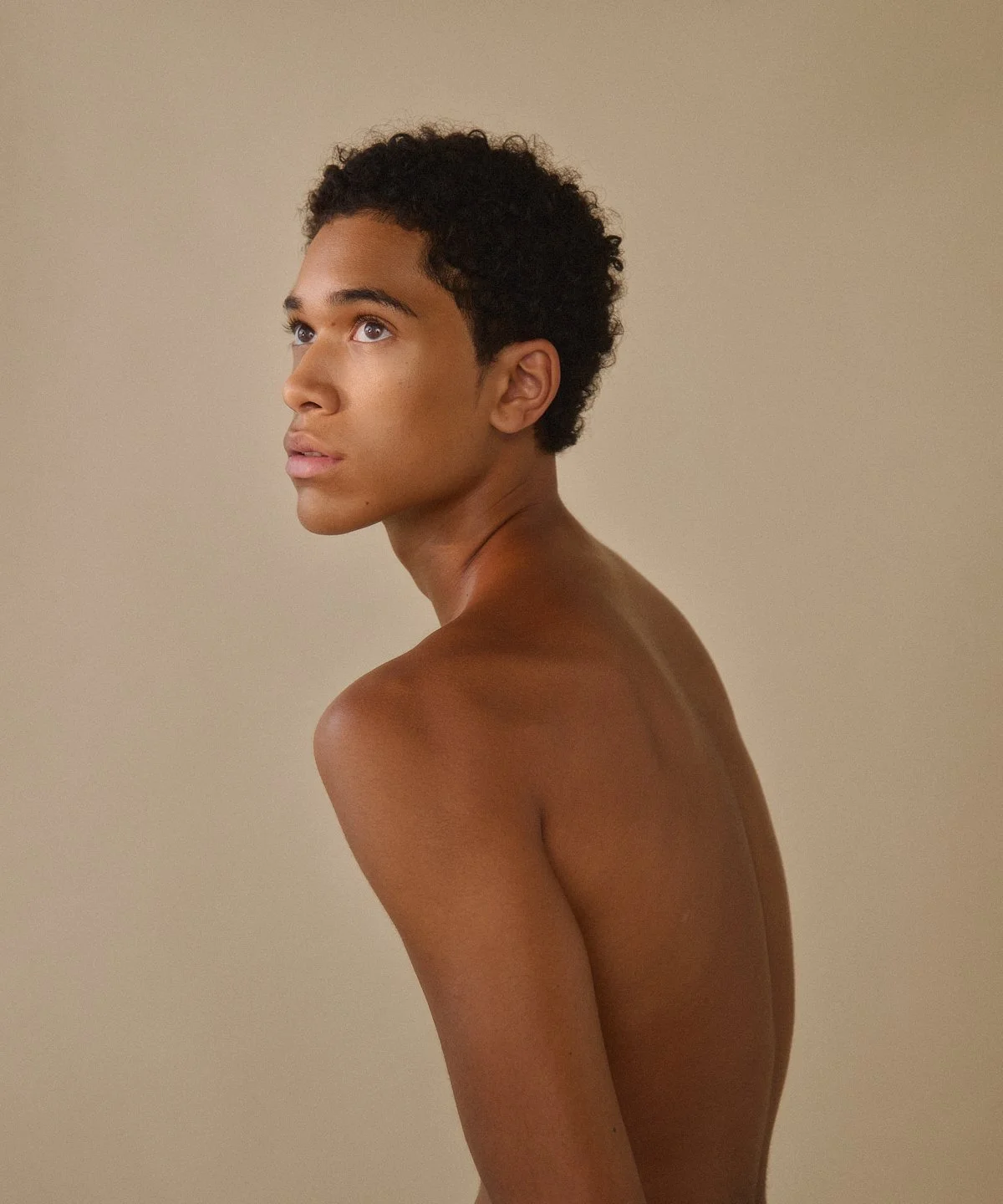 Model test: portrait looking off camera, shoulders bare