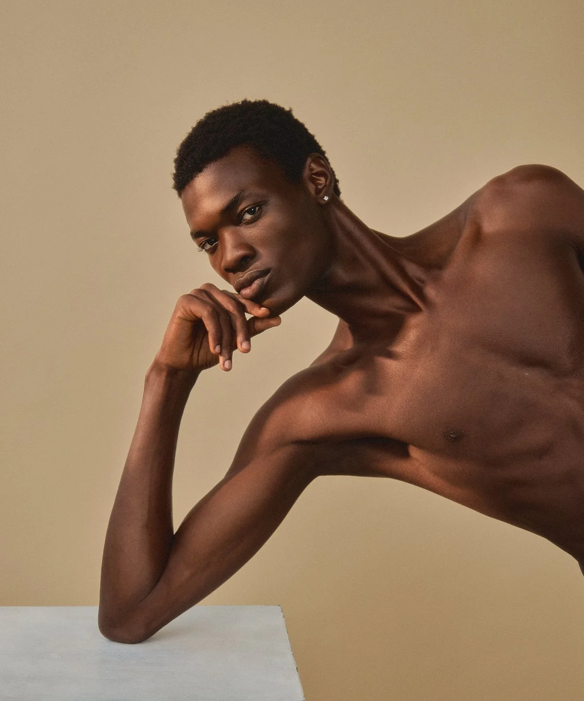 Model test: portrait resting his head on his hand