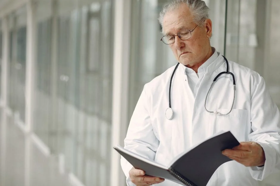 Orthopaedic surgeon reviewing medical records for a California QME evaluation
