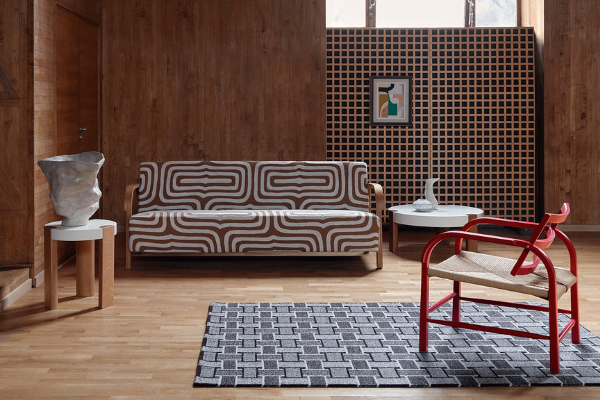 Mazo lifestyle image showing Arch Lounge Chair, Arch Sofa and Fer Table