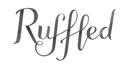 The word "Ruffled" written in cursive font on a black background.