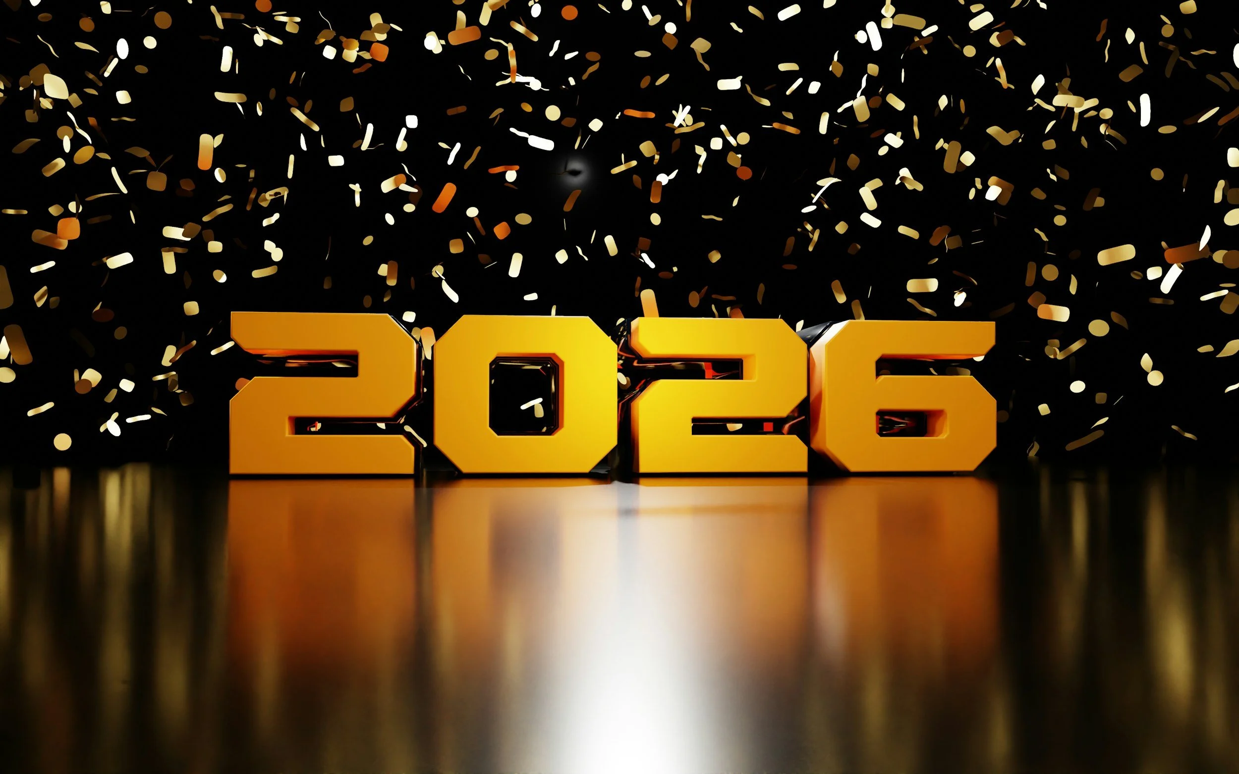 Celebratory scene with large golden numbers '2026' in front of black background, confetti falling, and reflections on a shiny surface.