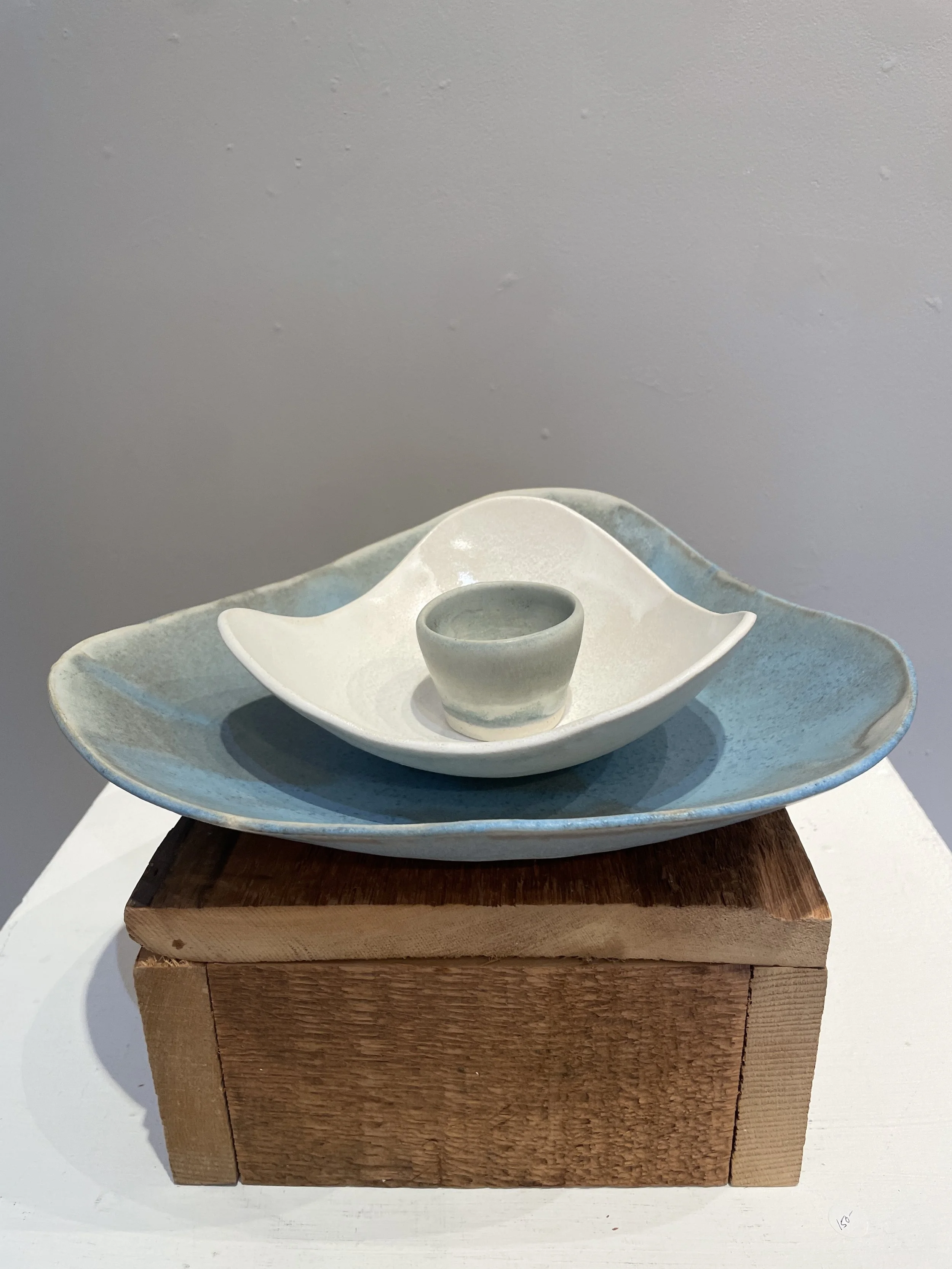 Set: Lg Blue, 12 in x 11 in; small matte/gloss white, 6 1/2 in x 7 1/2 in; small blue cup, 2 1/2 in x 1 1/2 in.
$250; sold
