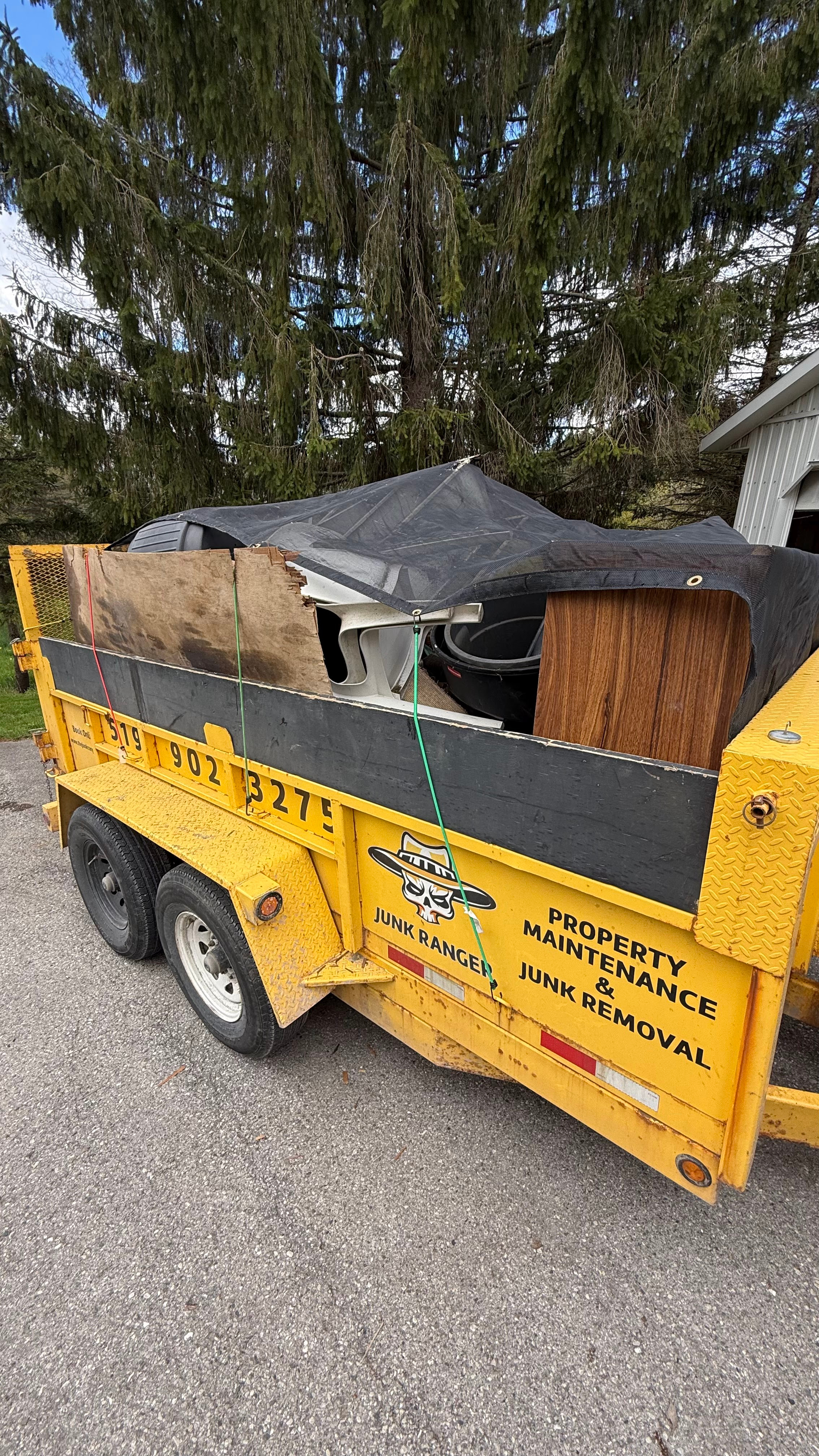 appliance removal London Ontario junk ranger crew removing fridge from kitchen same day pickup