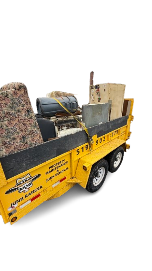 Junk Ranger truck and yellow trailer on a junk removal job in London, Ontario