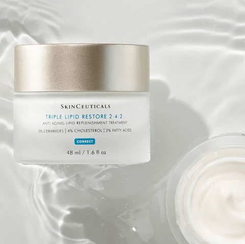 Skinceuticals Triple Lipid Restore 2:4:2 jar on white surface with water ripples.