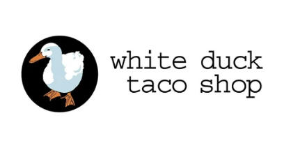 Logo of White Duck Taco Shop with a cartoon white duck inside a black circle, and the shop's name next to it.