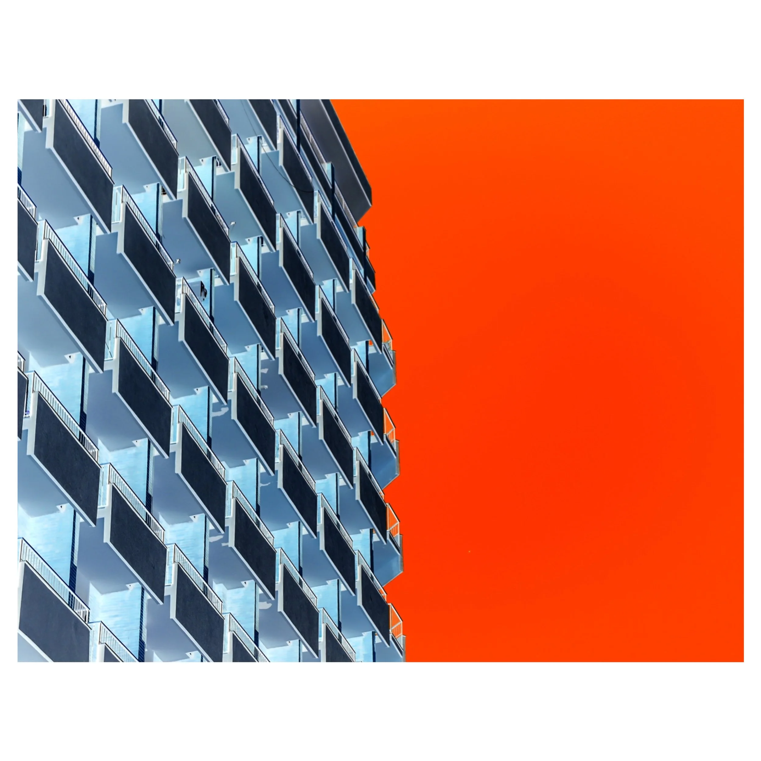 a photograph of a building with the colours of the sky inverted