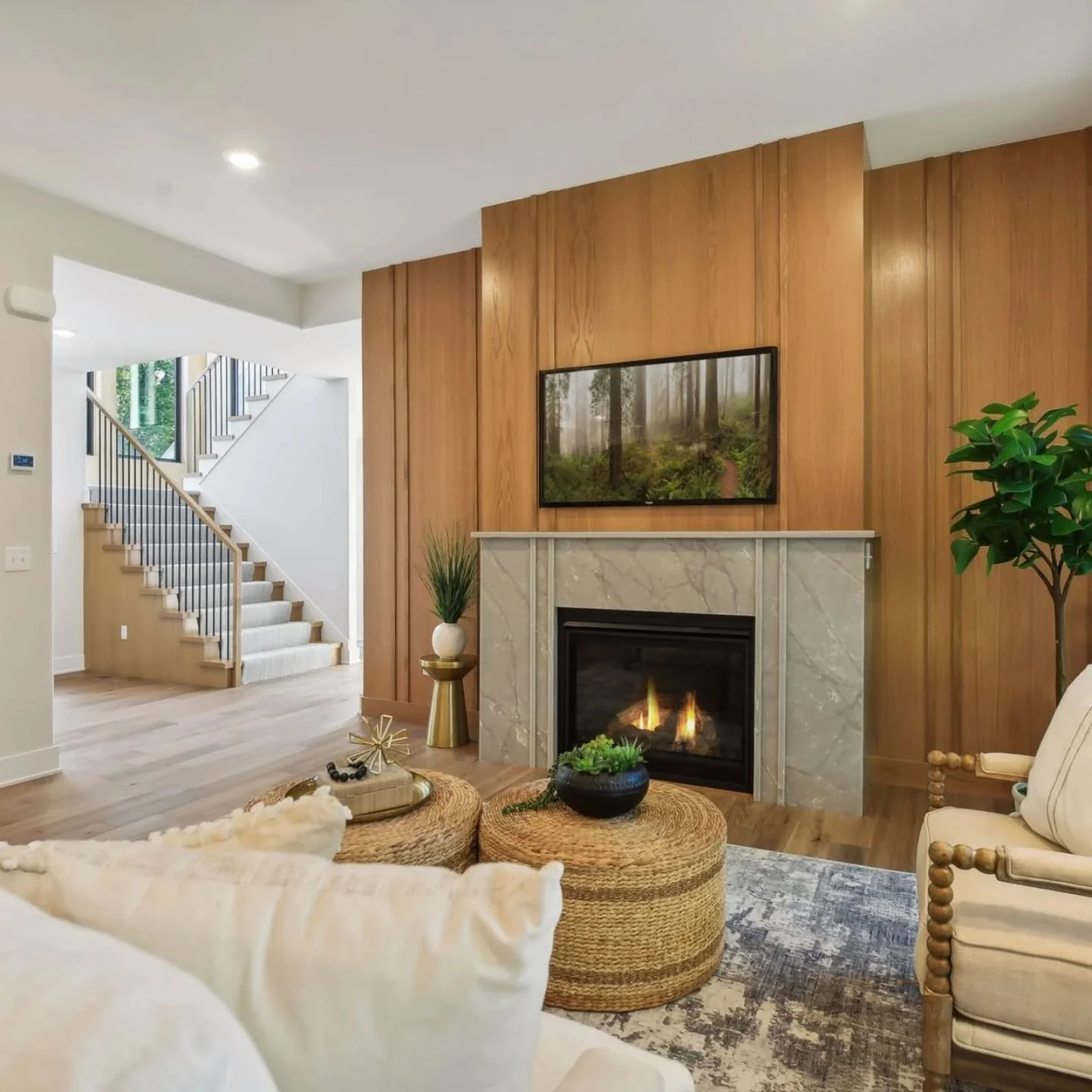 Wood tones are making a comeback - and we're obsessed! The wood paneling around the fireplace is everything. Cozying up here this fall is a must!

Builder @nrphomes 
Design @klinteriordesign_ 
Finish carpentry &amp; cabinetry @makersmn 

#finishcarpe