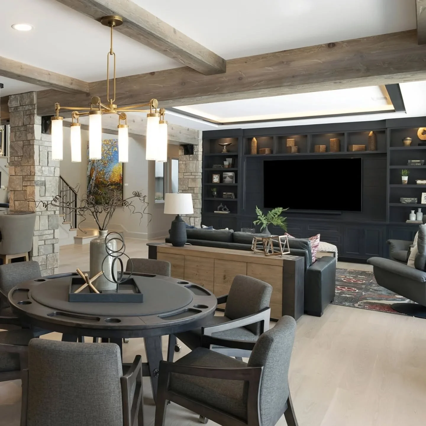 Where poker nights,  big games,  and good drinks all live under some good-looking beams.  Basement goals unlocked. 🍸&spades;️ 📺 

Build @wooddalebuilders 
📸 @spacecrafting_photography 

#finishcarpentry #custommillwork #luxuryhomesofmn #makersmn