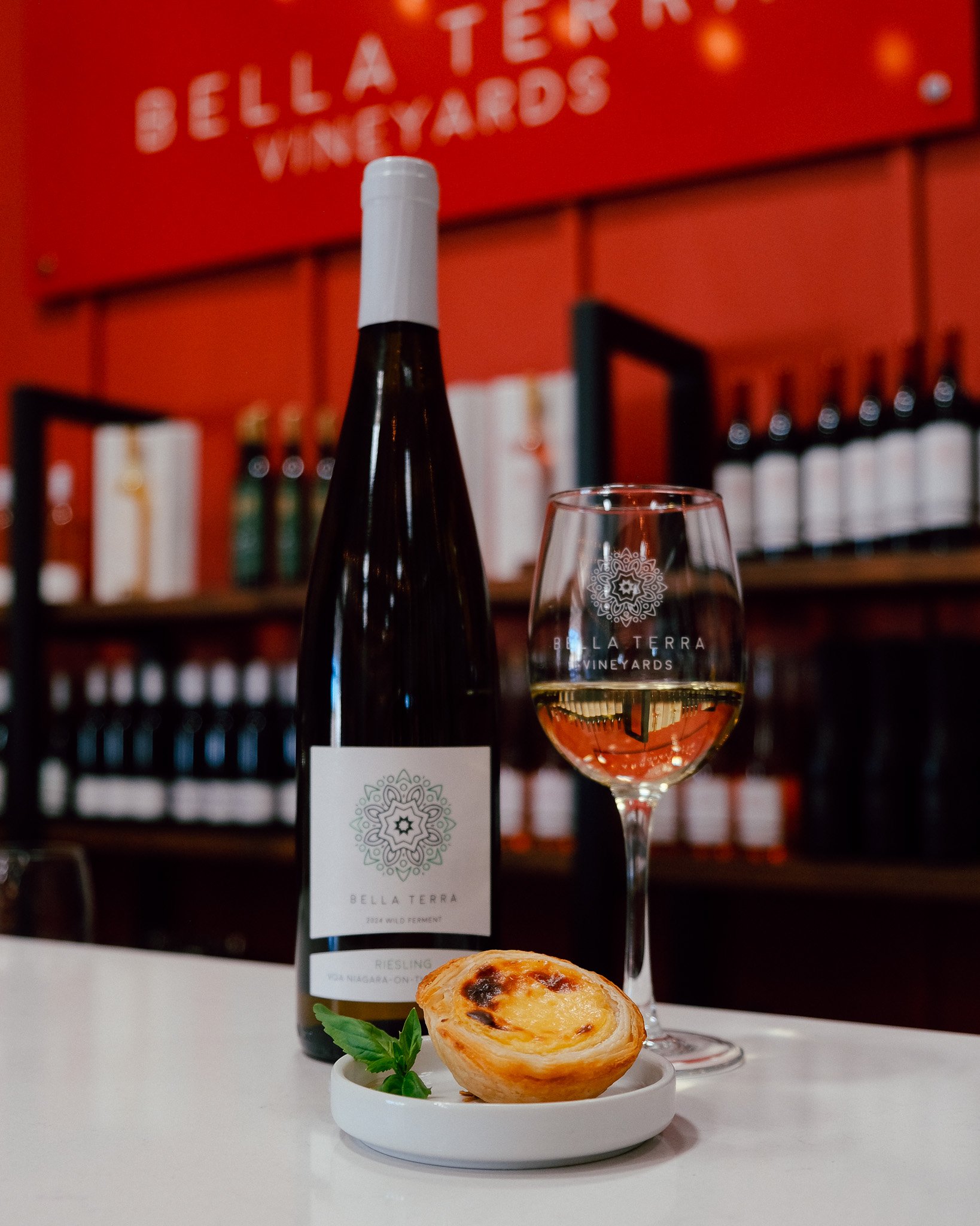 A glass of Bella Terra Wild Ferment Riesling with a sweet custard and apple pastry pairing