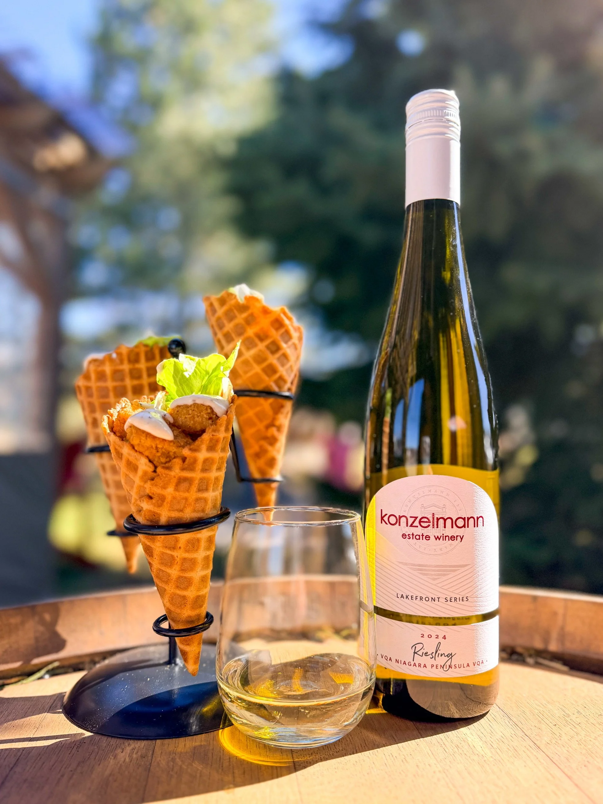 Chicken caesar salad in a waffle cone with a glass of Konzelmann Estates 2024 Riesling