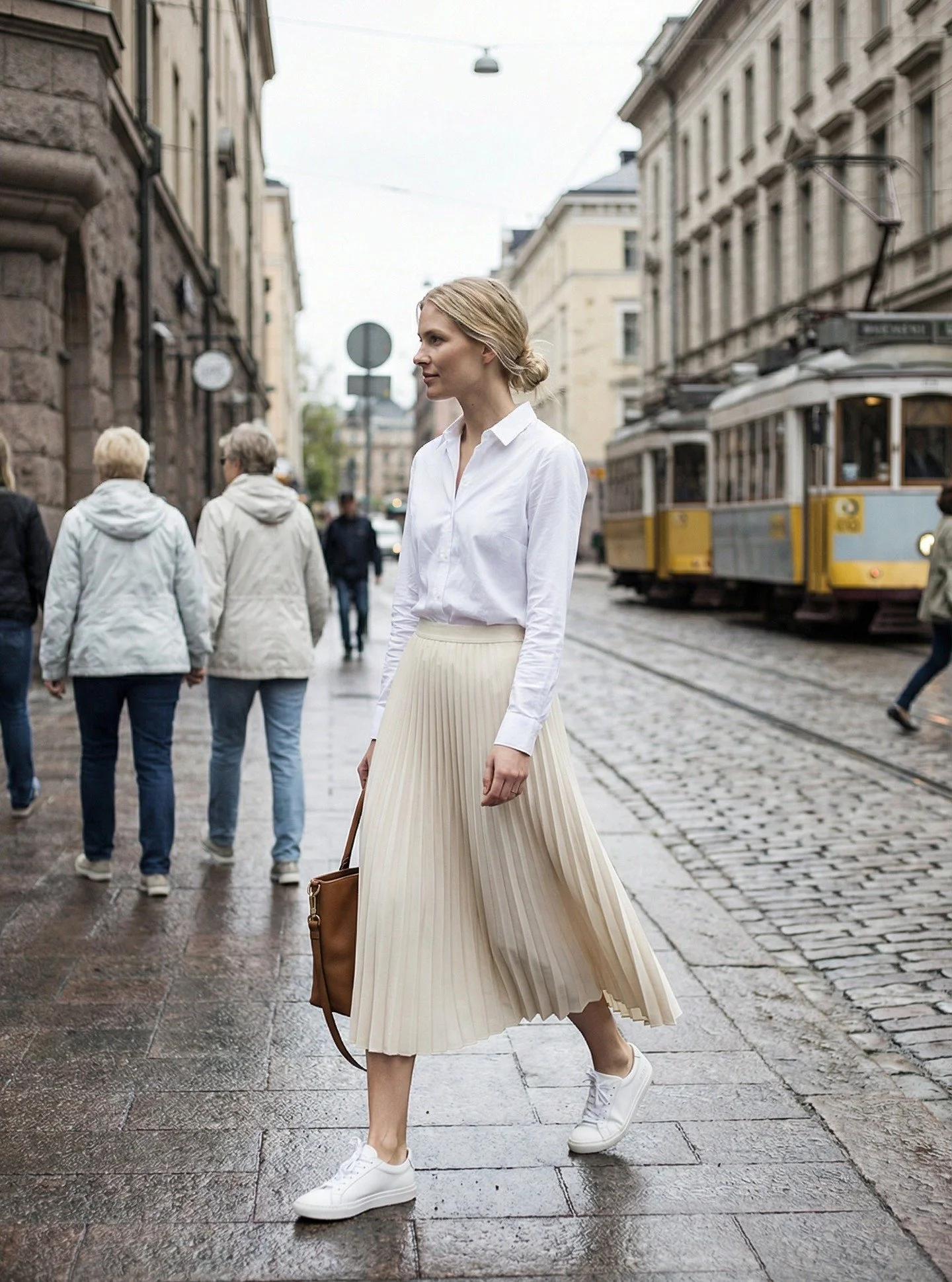 Parisian Minimalism &ndash; White Shirt &amp; Pleated Skirt

A crisp white shirt paired with a soft pleated midi skirt&mdash;clean, feminine, and effortlessly put together. Finished with simple sneakers and a classic leather bag for that everyday Eur