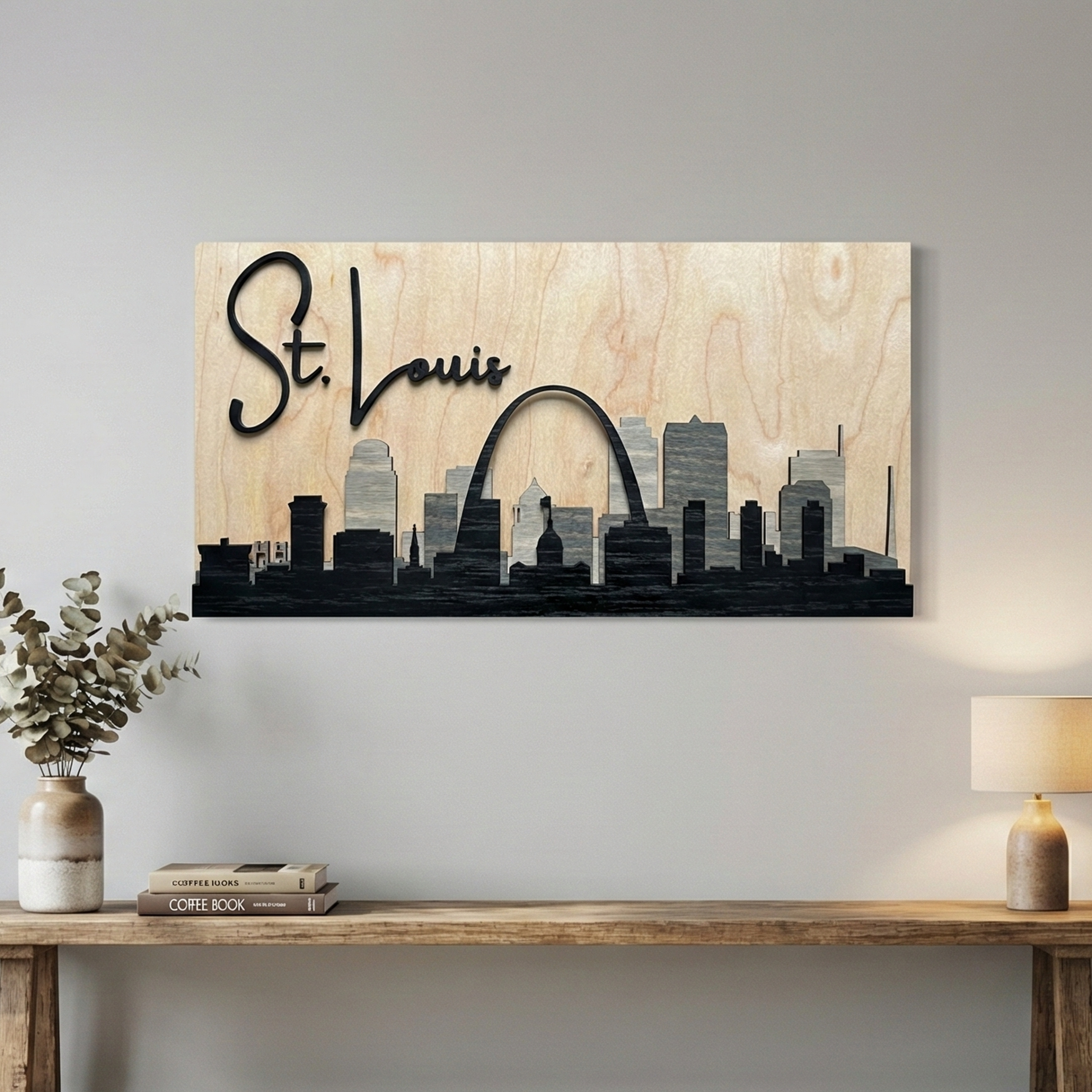 Large 3D grey St. Louis wood skyline art hanging above a long wooden console table in a modern room.