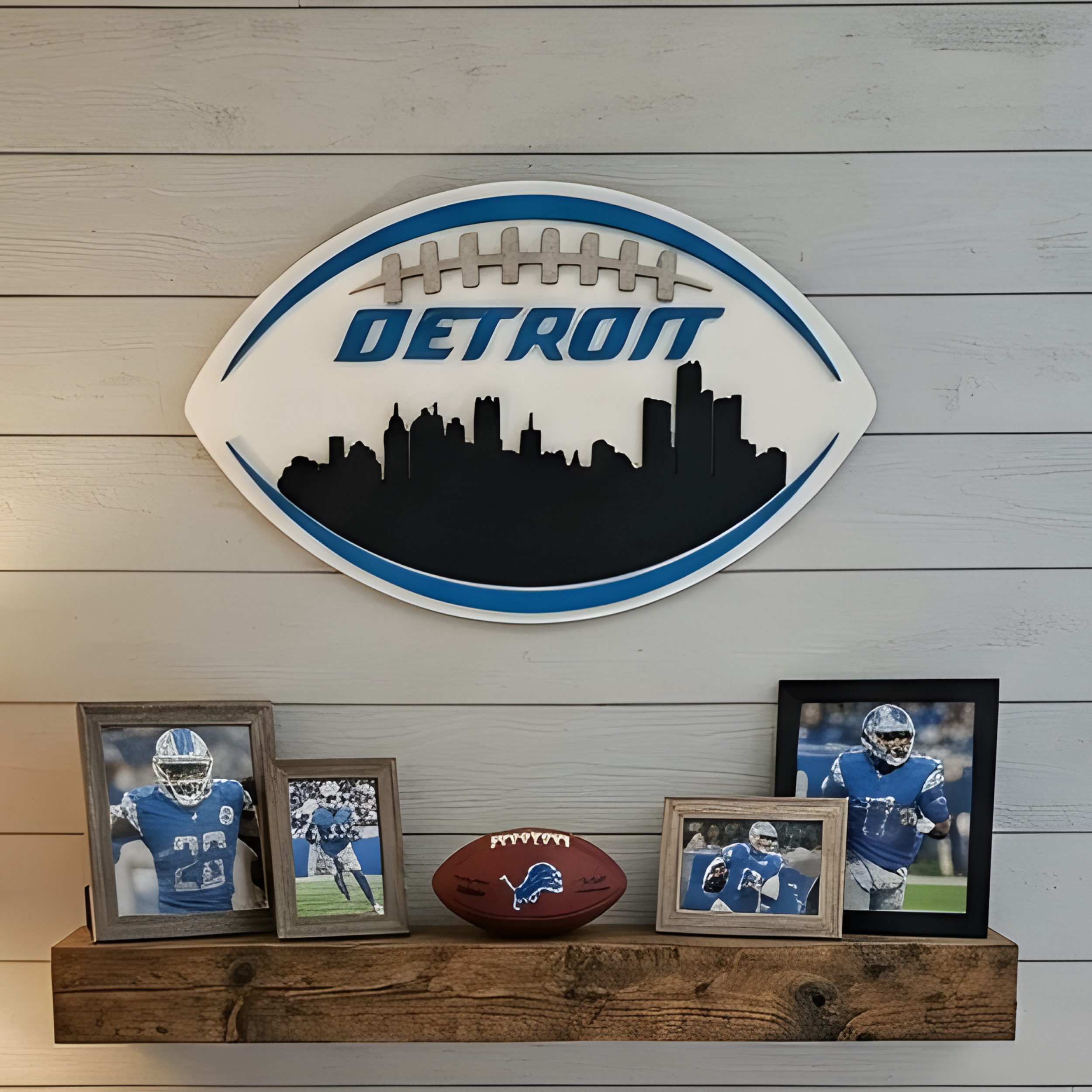 3D Detroit football sign displayed on white shiplap above a wooden shelf with Lions photos and a football.