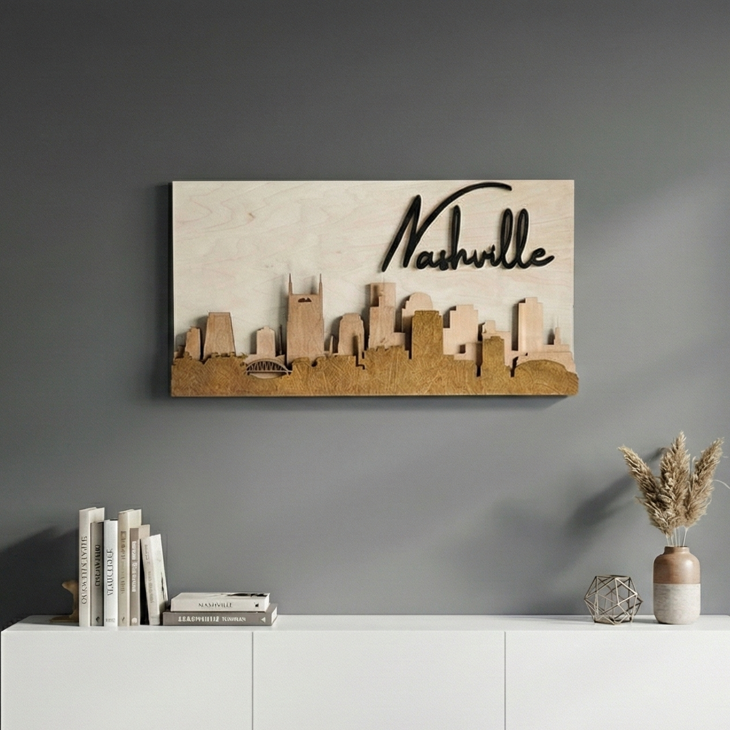 3D wood Nashville skyline wall art in brown stain hanging on a grey wall above a modern white console.