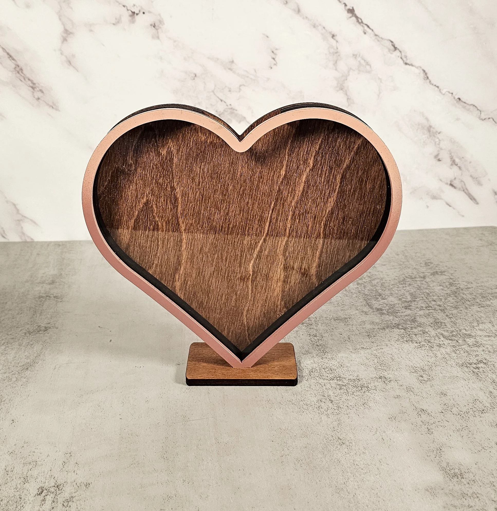 Front view of a ombre pink heart shaped display box.