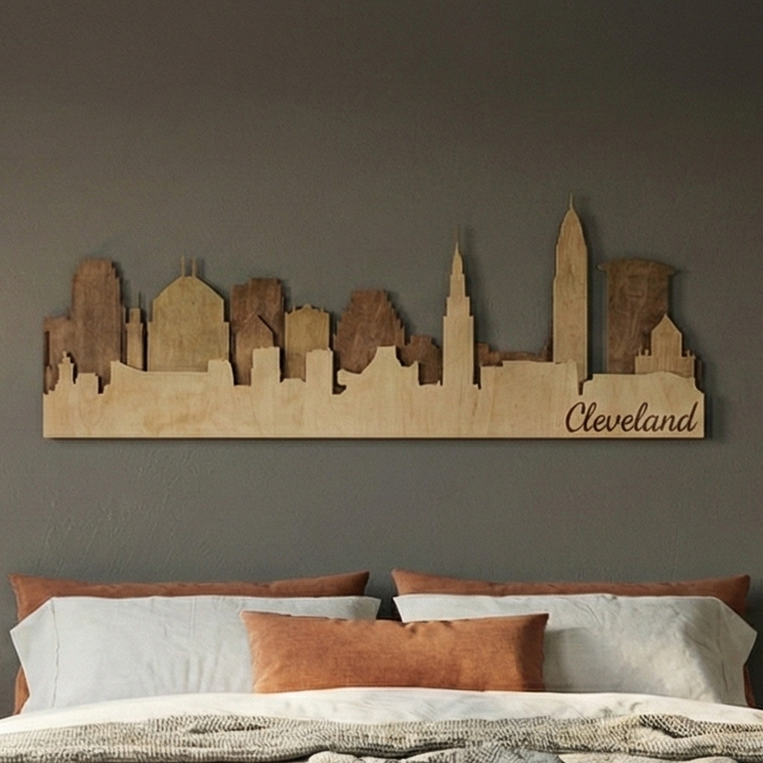 Close-up of a 3-layer wood Cleveland skyline showing intricate laser-cut details and brown stain.