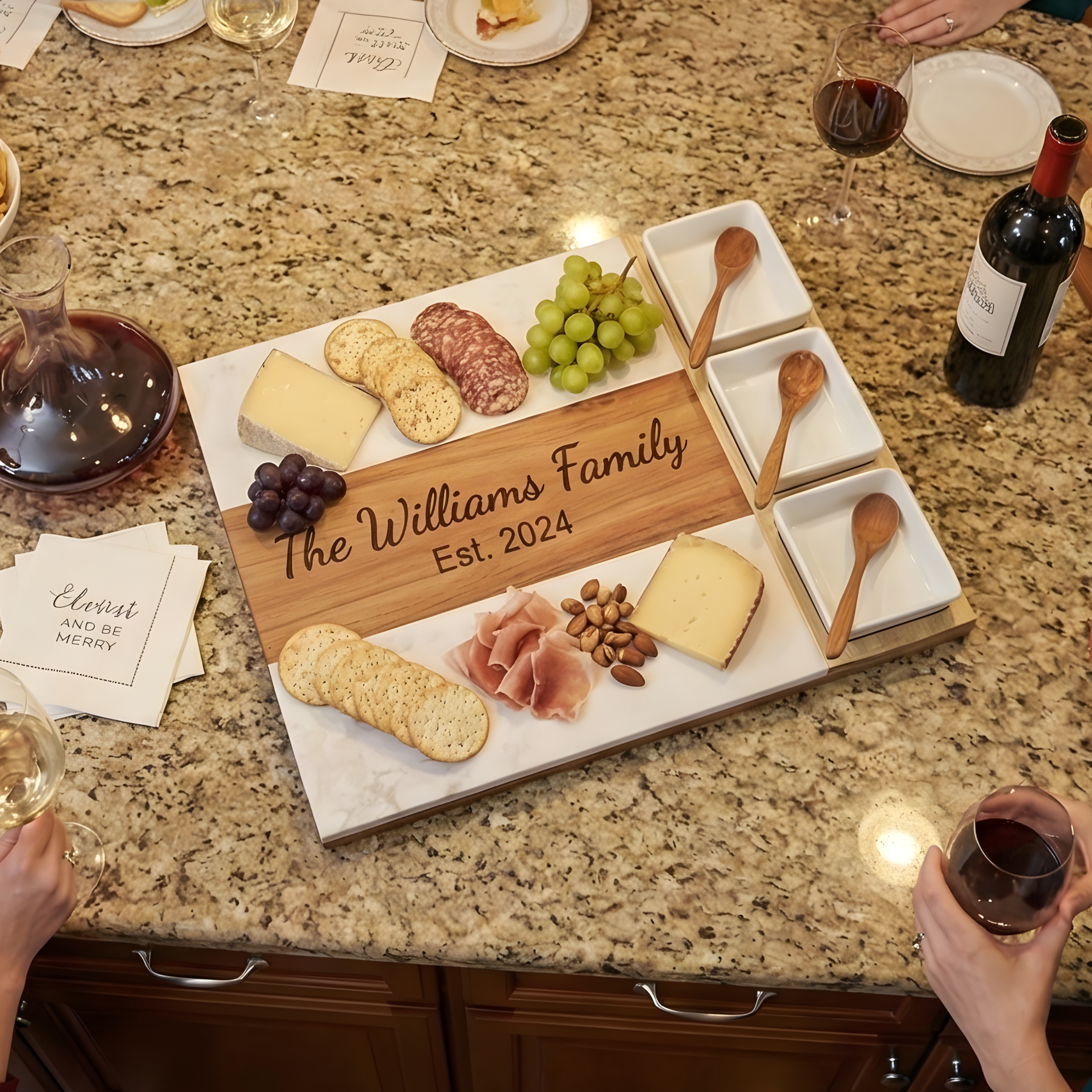 Overhead shot of a charcuterie board with The Williams Family Est 2024 engraving.