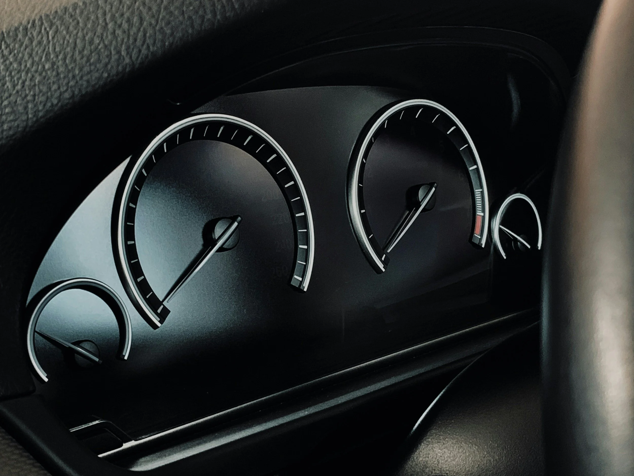 Close-up of car dashboard with speedometer and gauges