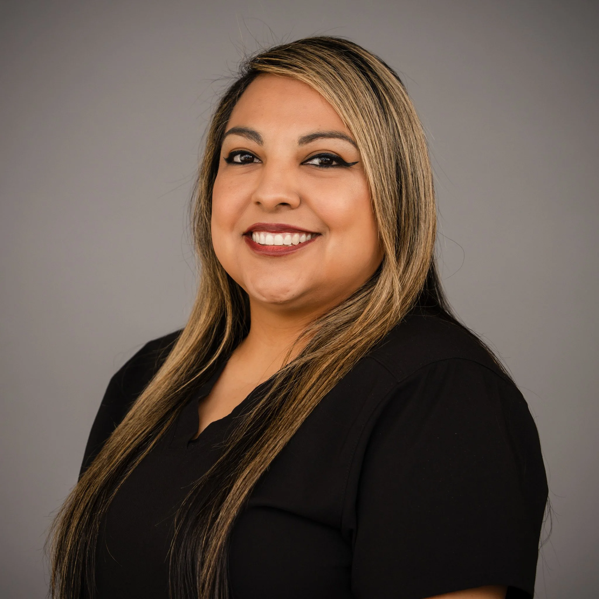 Woman smiling in black shirt
