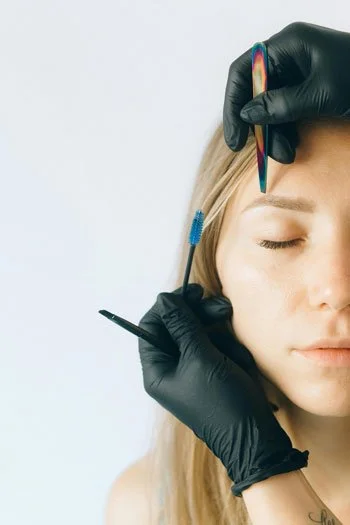 Marking a woman's face while planning a treatment at Skinspirations