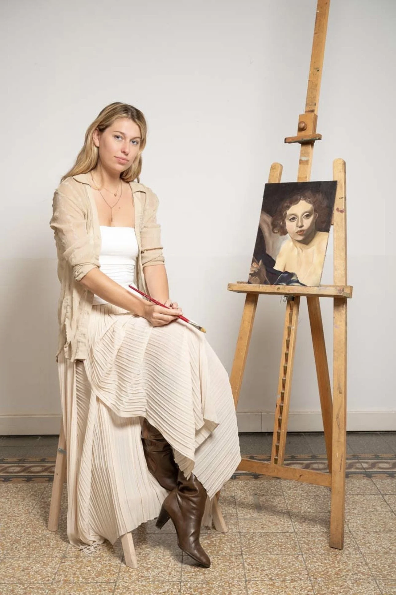 Woman painting at easel in art studio — Brynn Gerl oil painter at work