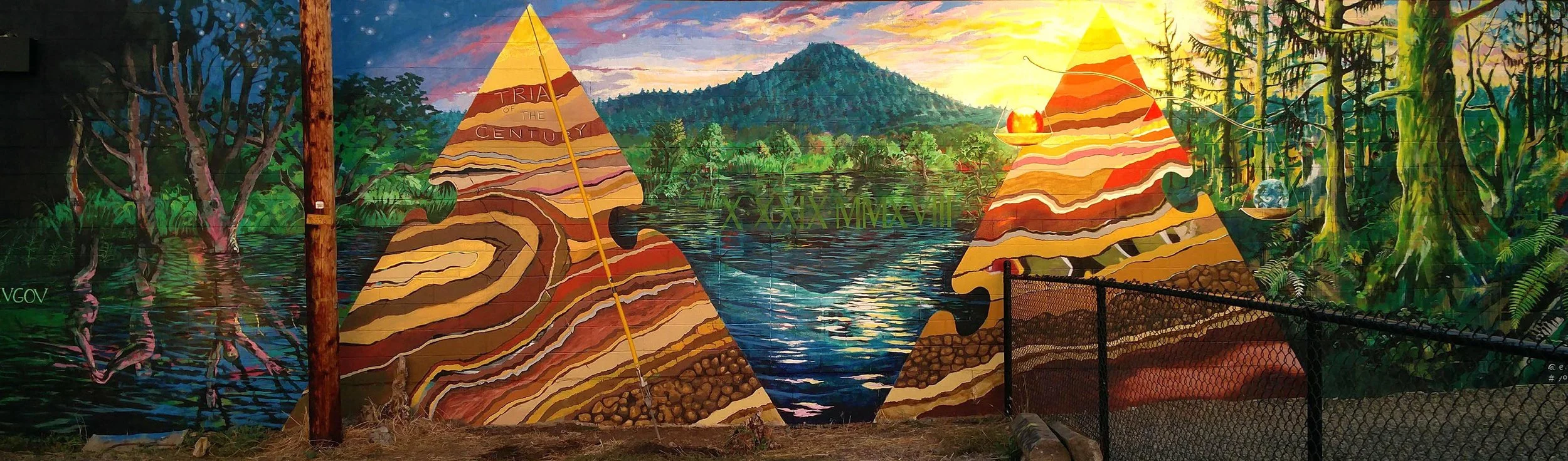 Climate awareness mural depicting Spencer Butte and sedimentary rock formations, Eugene Oregon, 2020, assistant muralist Brynn Gerl