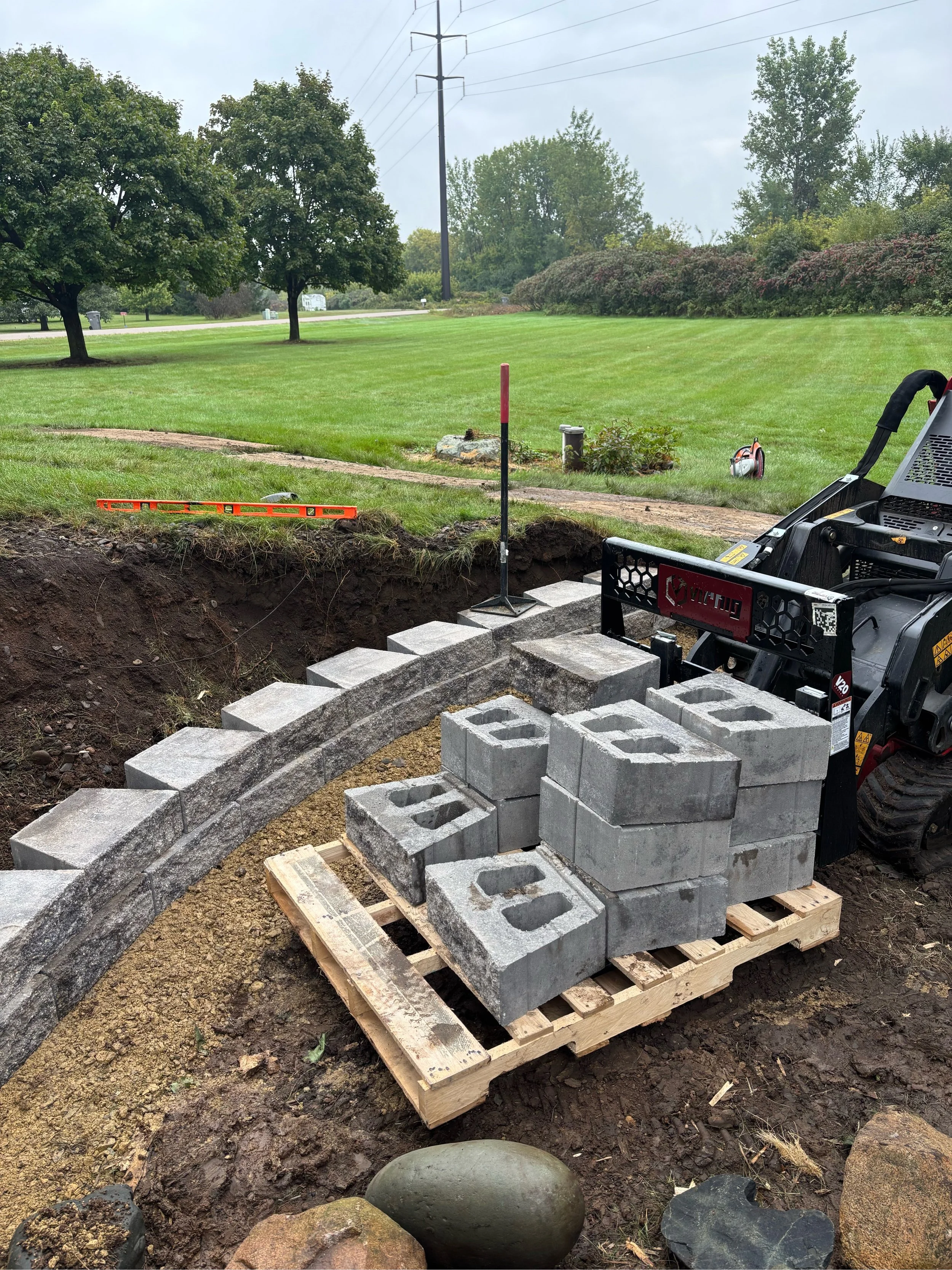 Wall install prior concrete patio