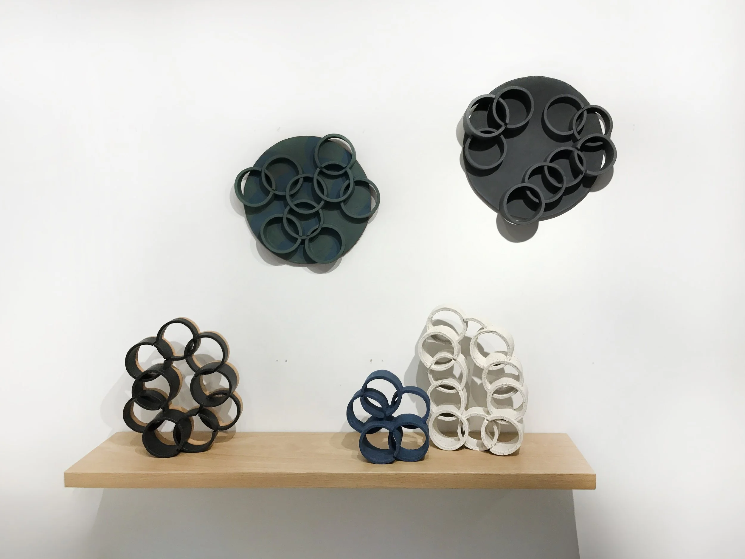 Ben-Medansky-ceramic-wall-sculpture-shelf-loops-Room68-exhibition-install.jpg