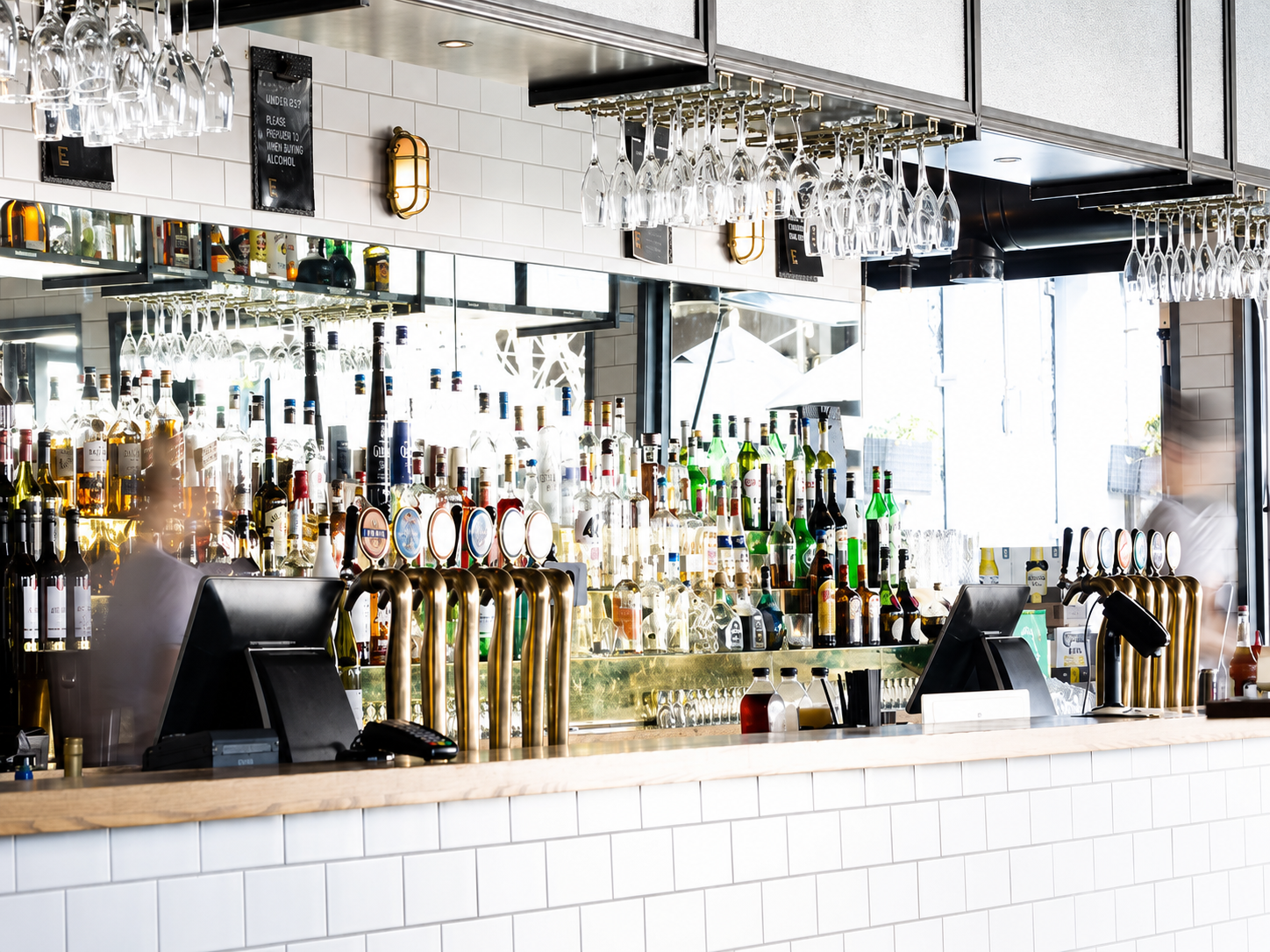 Main Bar at Royals with full bar setup and natural daylight