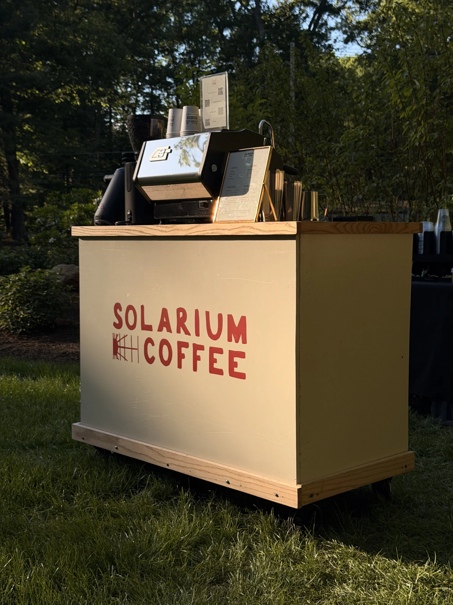 Solarium Coffee espresso cart set up outdoors at sunset