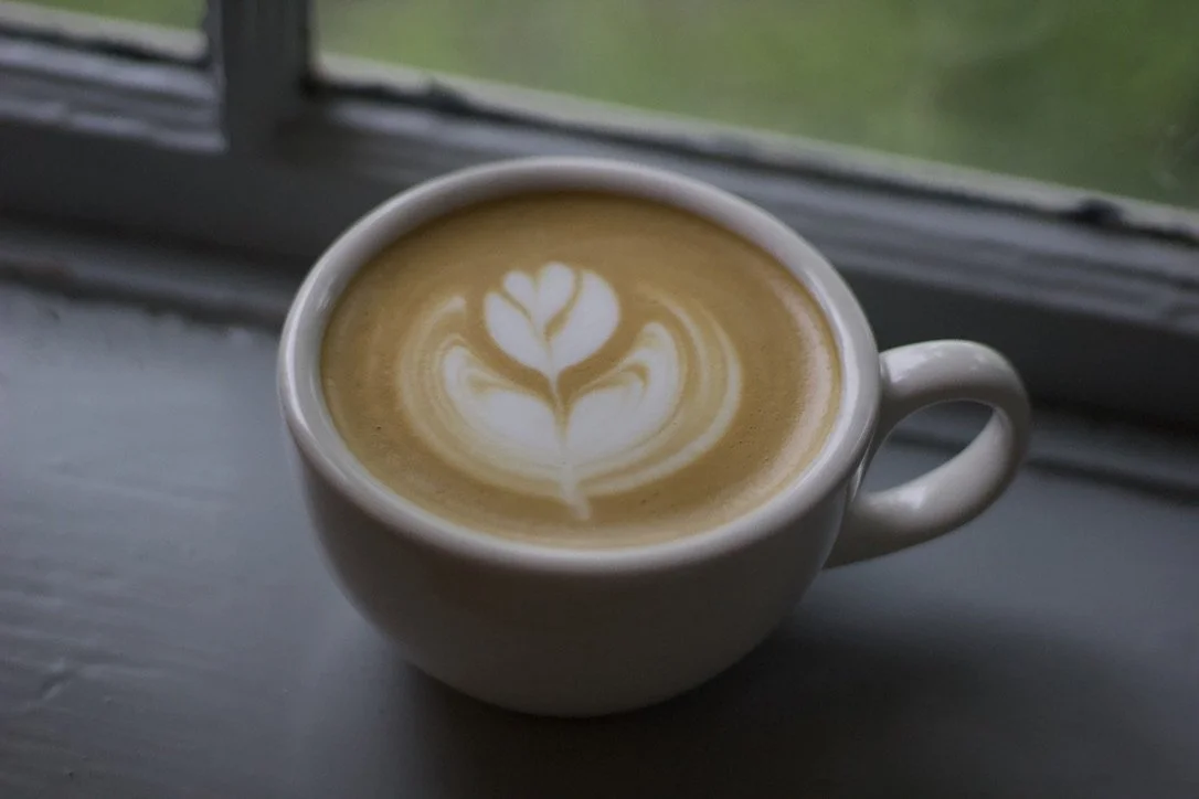 latte on window sill at residential coffee event.